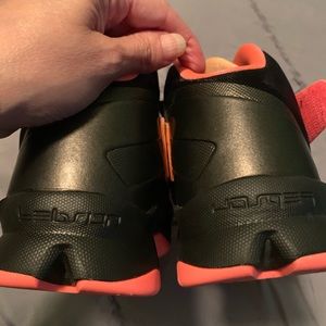 Nike Lebron James high top tennis shoes.